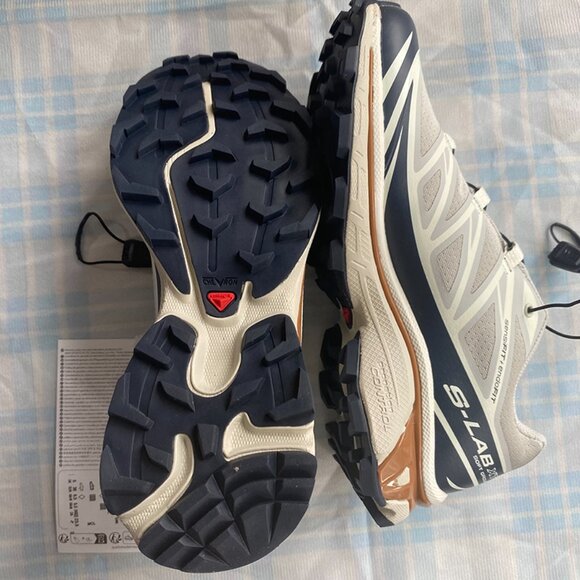 Salomon Sneakers Are Light Gray With Black Laces. - Picture 2 of 9